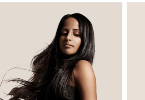 Model with long flowing black lace front wig